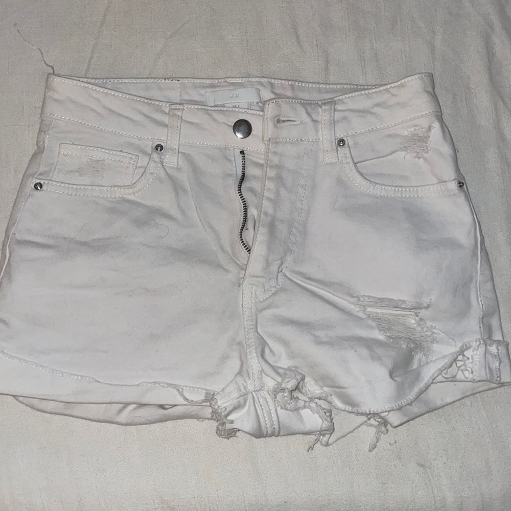 High waisted distressed white shorts